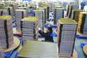 Workers labor at a factory of coolant radiators for air conditioners in Yuexi county in central Chi…