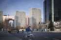 A man cycles pass a traffic junction with the office buildings around the Central Business District…