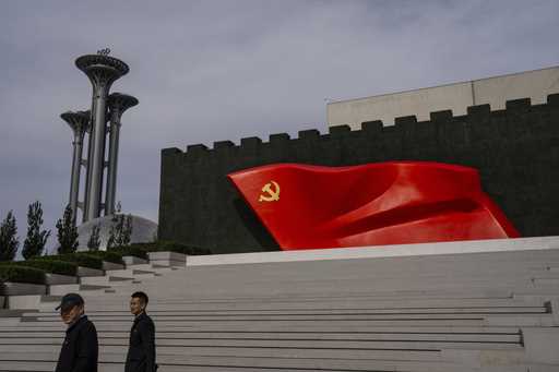 Visitors pass the Chinese Communist Party flag at the museum of the Communist Party of China in Bei…