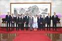 In this photo released by Xinhua News Agency, Chinese Foreign Minister Wang Yi, sixth from left, po…