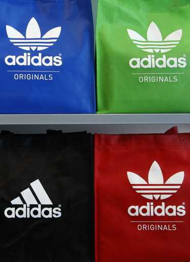In this file photo dated May 7, 2009 the company's logo is pictured on shopping bags in the Adidas …