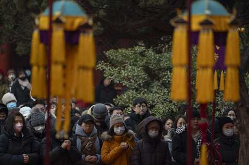 Faithfuls attend a Taoist ritual to seek blessings and protection from Tai Sui, deities associated …