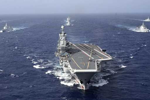 In this photo released by Xinhua News Agency, conventionally powered Chinese aircraft carrier Liaon…