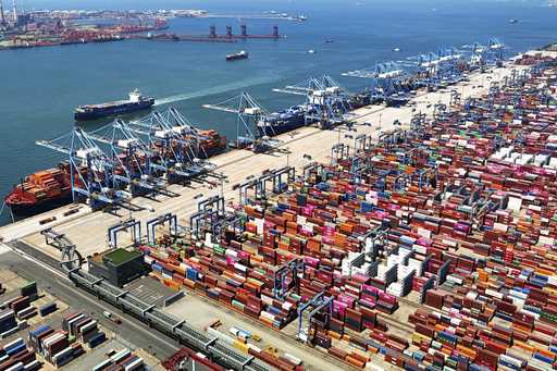 An aerial view of a container port is seen in Qingdao in east China's Shandong province June 6, 202…