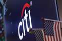 The logo for Citigroup appears above a trading post on the floor of the New York Stock Exchange on …