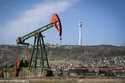 A pumpjack operates at a drilling site in Baku, Azerbaijan, Monday, Sept