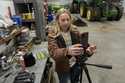 Zoe Kent prepares to create a social media video, Monday, January 20, 2025, at her farm in Bucyrus,…