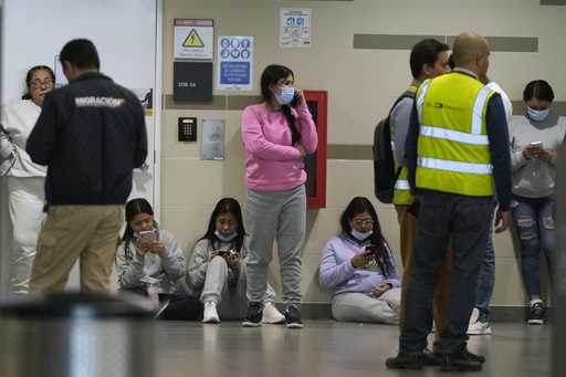 Colombian migrants deported from the United States wait inside El Dorado airport after arriving in …