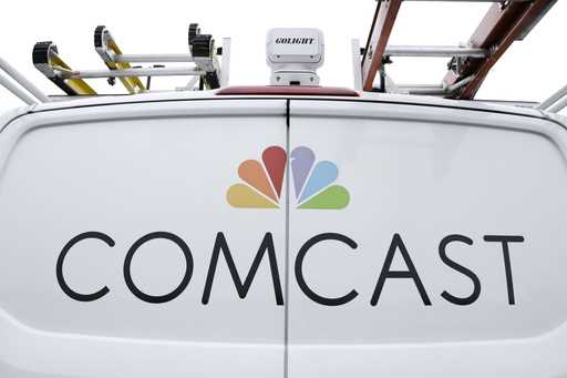 FILE- A Comcast truck is shown on January 24, 2019, in Pittsburgh. (AP Photo/Gene J. Puskar, File)