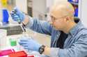 A lab technician prepares DNA samples for analysis at Complete Genomics in San Jose, Calif