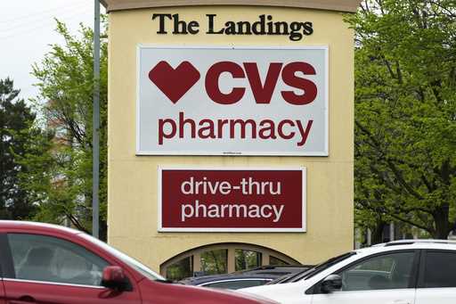 CVS pharmacy and drive-thru signs are seen outside of CVS store in Park Ridge, Ill