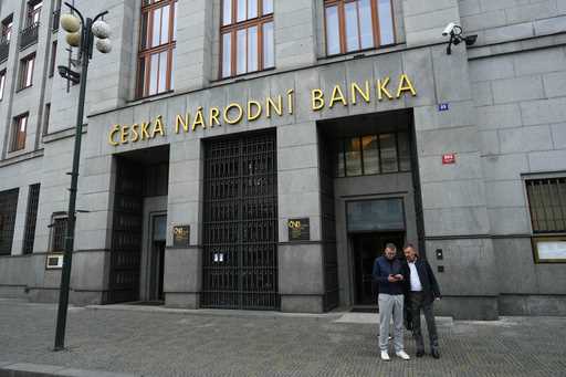 People stand outside the Czech central bank in Prague, Czech Republic, Thursday, November 2, 2023