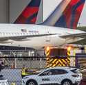 Multiple Atlanta Fire Rescue Department units and police park outside a Delta Maintenance facility …