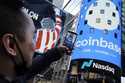 The Coinbase logo covers the Nasdaq MarketSite in New York's Times Square, April 14, 2021