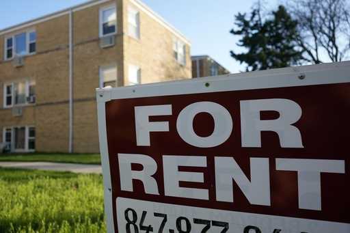 A sign is displayed outside an apartment building in Skokie, Ill