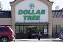 A woman leaves a Dollar Tree store in Urbandale, Iowa, on February 25, 2021