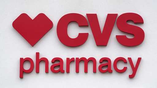 The CVS Pharmacy logo is displayed on a store on August 3, 2021, in Woburn, Mass