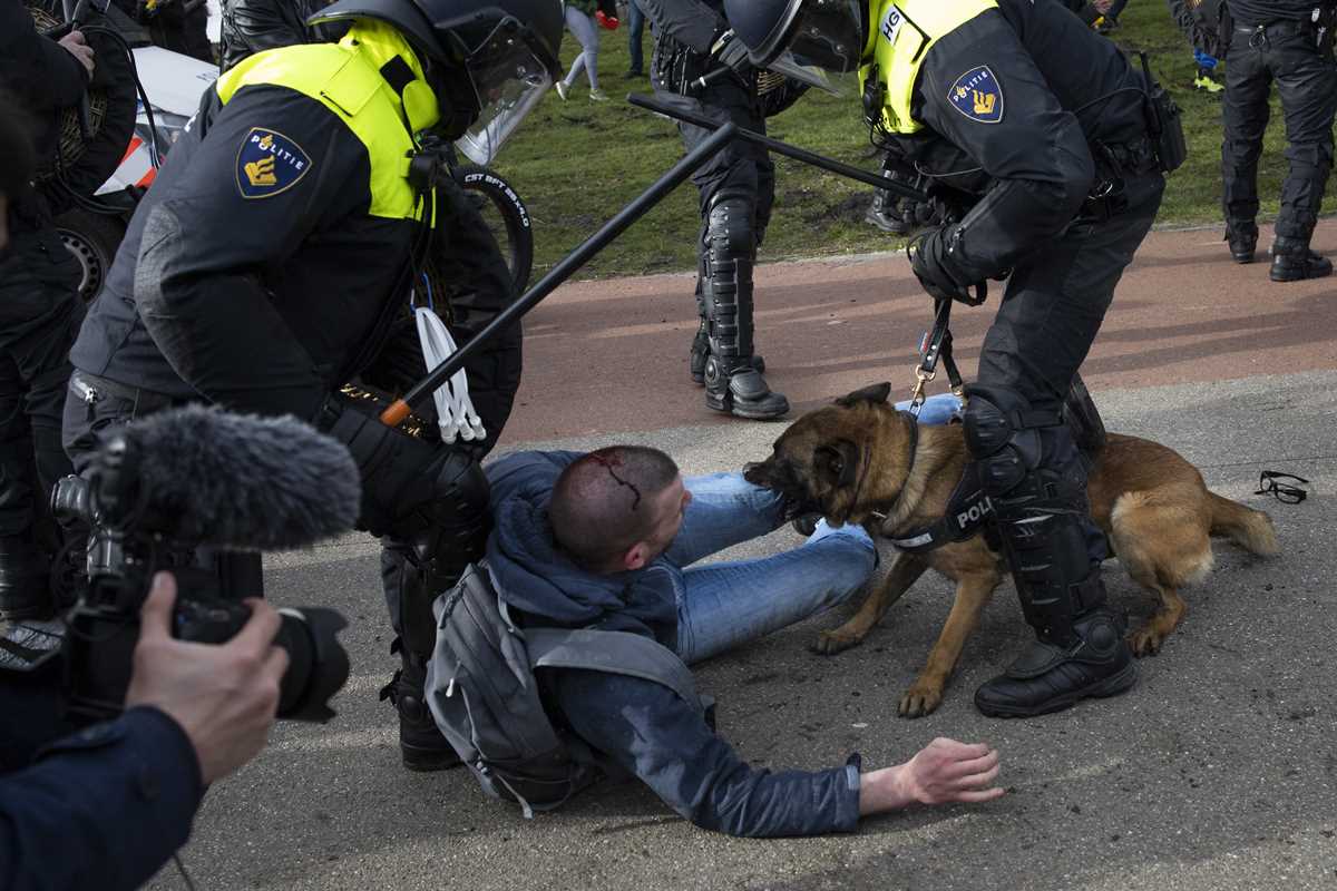 https://www.marketbeat.com/images/associated-press/dutch-police-break-up-anti-govt-protest-on-eve-of-election--2021-03-14-4-primaryphoto.jpg