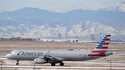 An American Airlines jetliner rumbles down a runway at Denver International Airport, January 16, 20…