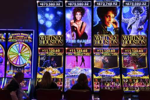 Gamblers play slot machines at the Hard Rock casino in Atlantic City, N