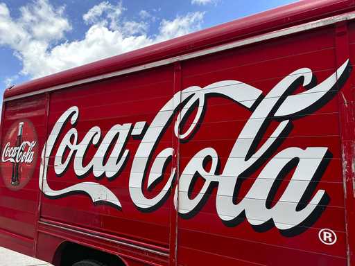 The Coca-Cola logo adorns the side of a delivery truck May 15, 2024, in southeast Denver