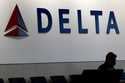 A man waits for a Delta Airlines flight at Hartsfield-Jackson International Airport in Atlanta, Jan…