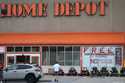 Lawnmowers are lined up on display outside a Home Depot store in Uniontown, Pa