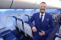 Ryan Munoz, a flight attendant with Southwest Airlines, poses in the airline's newly designed unifo…