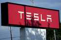 Tesla sign is shown at Tesla dealership in Schaumburg, Ill