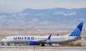 A United Airlines jetliner rumbles down a runway for take off from Denver International Airport on …