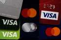Several VISA and MASTER credit cards are shown in Buffalo Grove, Ill
