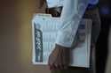 A person waits in a line for a prospective employer at a job fair, Thursday, August 29, 2024, in Su…