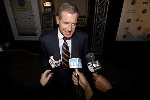 Television journalist Brian Williams arrives at the Asbury Park Convention Hall during red carpet a…