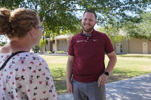 Trevor Cowling helps out during an activity class at a summer camp for youth at Valley Baptist Chur…