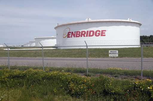 The corporate name stands out on tanks shown Friday, June 29, 2018 at at the Superior terminal of E…