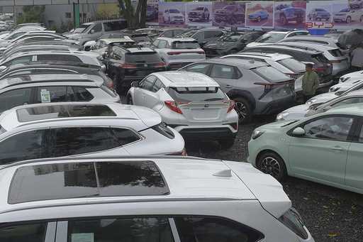 A batch of electrical vehicles for sale parked at a car yard in Addis Ababa, Ethiopia Thursday, Oct…