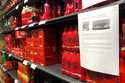 A note is posted next to cleared cases of soft drinks sitting on a shelf in a supermarket in Antwer…