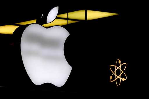 The Apple logo is illuminated at a store in Munich, Germany, Monday, November 13, 2023