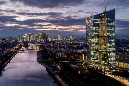 The European Central Bank, right, stands amid buildings in the banking district of Frankfurt, Germa…