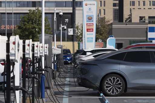 Electric vehicle charging stations are seen in Beijing, Friday, October 11, 2024