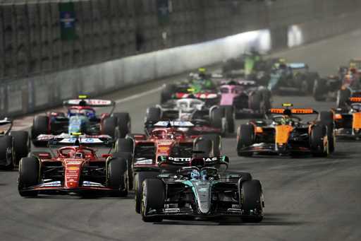 Mercedes driver George Russell, of Britain, leads the field during the F1 Las Vegas Grand Prix auto…