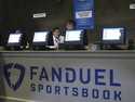 Workers at the FanDuel sports book at the Meadowlands Racetrack in East Rutherford N