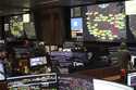 Union Pacific dispatchers keep track of trains moving across the western United States at the Harri…