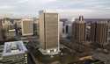 The Federal Reserve building, center, rises high over the skyline of Richmond, Va