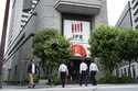 People walk in front of Tokyo Stock Exchange building in Tokyo, on May 28, 2024