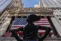 The New York Stock Exchange is shown behind the statue titled "Fearless Girl", Thursday, December 1…