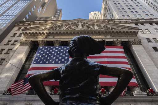 The New York Stock Exchange is shown behind the statue titled "Fearless Girl", Thursday, December 1…