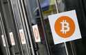 Bitcoin logos are displayed at the Inside Bitcoins conference and trade show on April 7, 2014, in N…