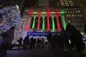 People gather in front of the New York Stock Exchange in New York's Financial District on Tuesday, …