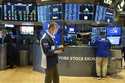 People work on the floor at the New York Stock Exchange in New York, Thursday, February 27, 2025